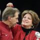 Nick Saban wife Terry Saban removes confetti from his hair