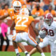 Slade Bolden runs ball in between two Tennessee defenders