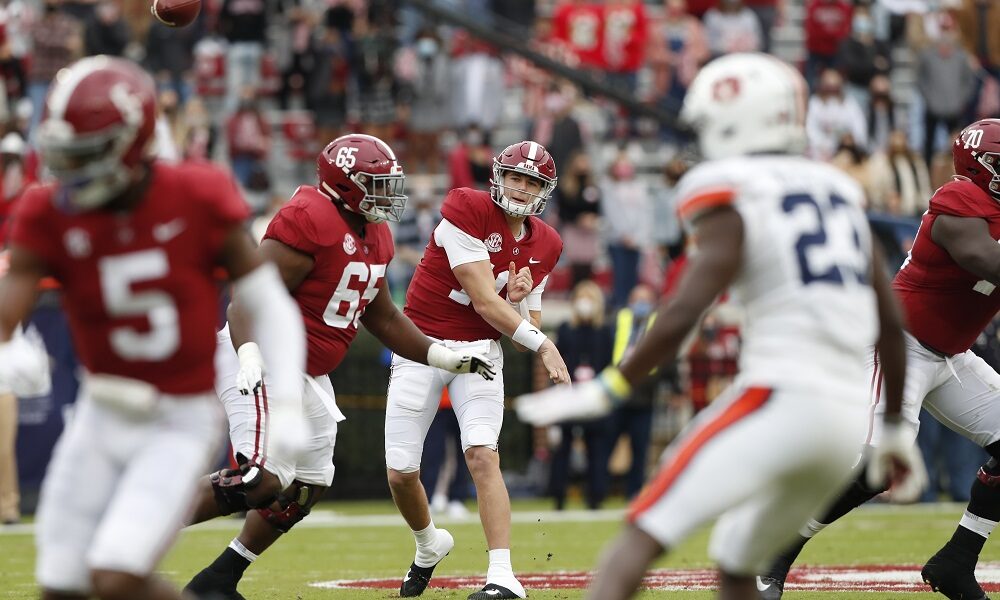 Mac Jones throwing the football