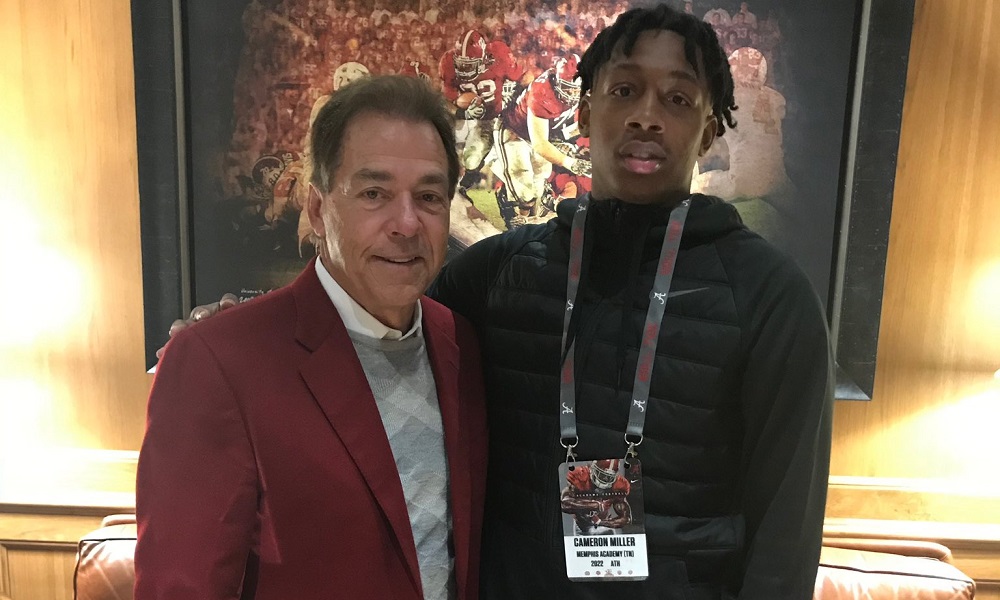 Cameron Miller poses for Picture with Nick Saban during visit