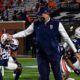 Gus Malzahn talks with the team prior to playing Tennessee