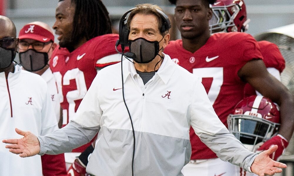Nick Saban gestures to the official from the sidelines
