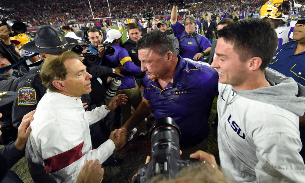 Nick Saban and Ed Orgeron meet at midfield after 2019 game between Alabama and LSU