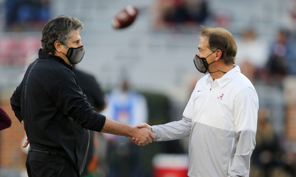 Nick Saban and Mike Leach shake hands in pregame