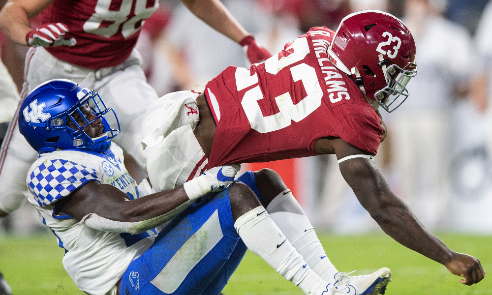 Roydell Williams running through a Kentucky defender