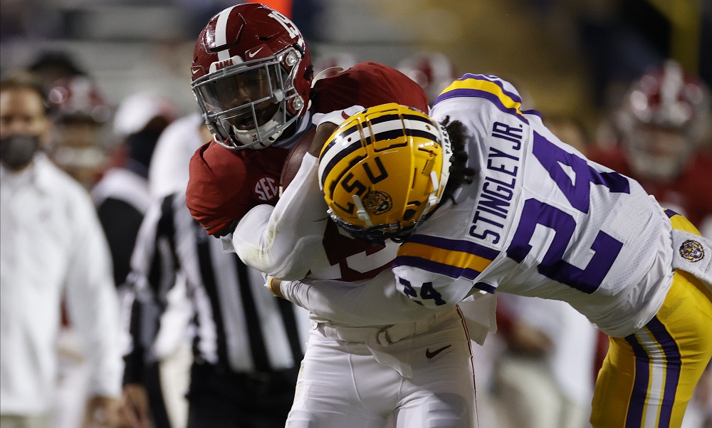 Alabama TE Jahleel Billigsley carries the football against LSU