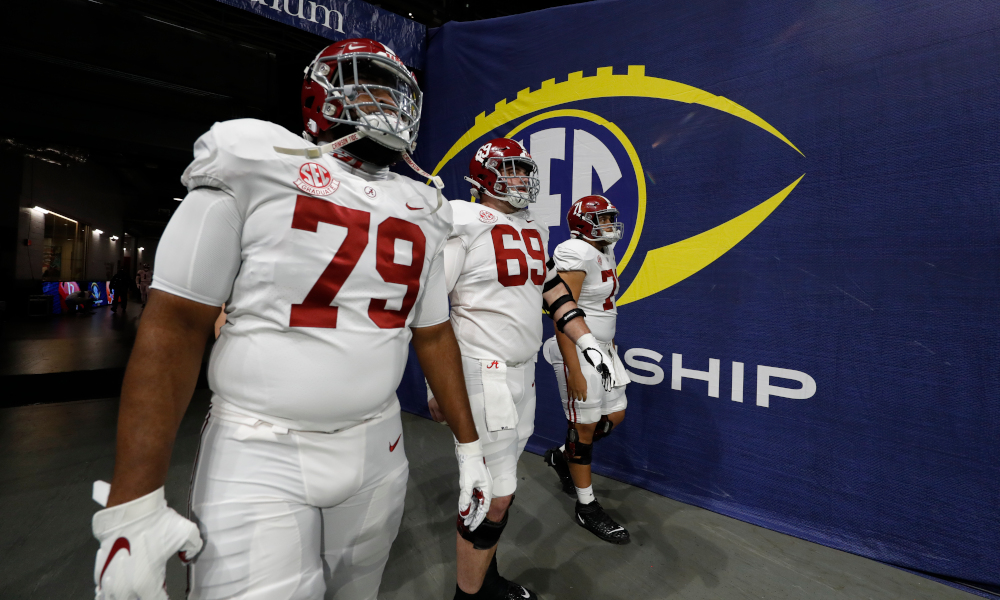 Alabama OL Chris Owens (No. 79), Landon Dickerson (No. 69) and Darrian Dalcourt (No. 71) take the field for SEC title game
