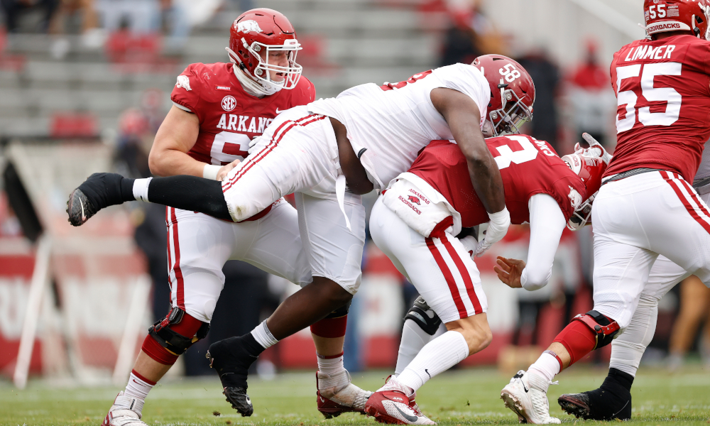 Christian Barmore (No. 58) of Alabama sacks Feleipe Franks of Arkansas