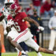 DeVonta Smith (No. 6) running with the ball for Alabama versus Auburn