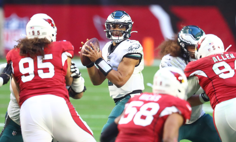 Jalen Hurts in the pocket for Eagles attempting a pass versus Cardinals