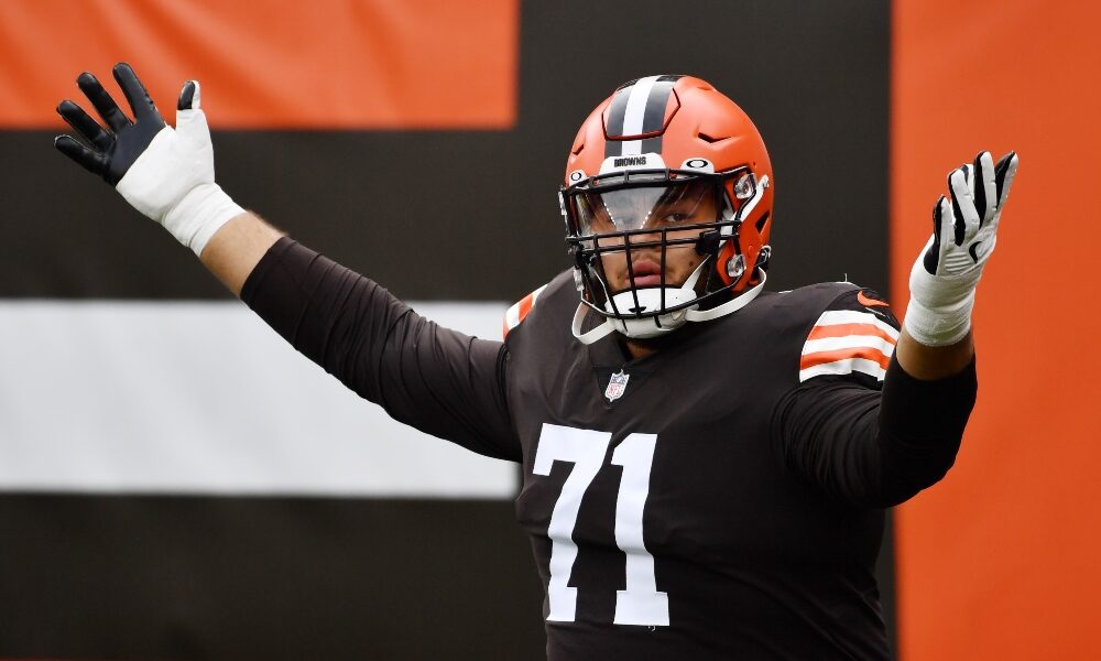 Jedrick Wills gestures to the referees