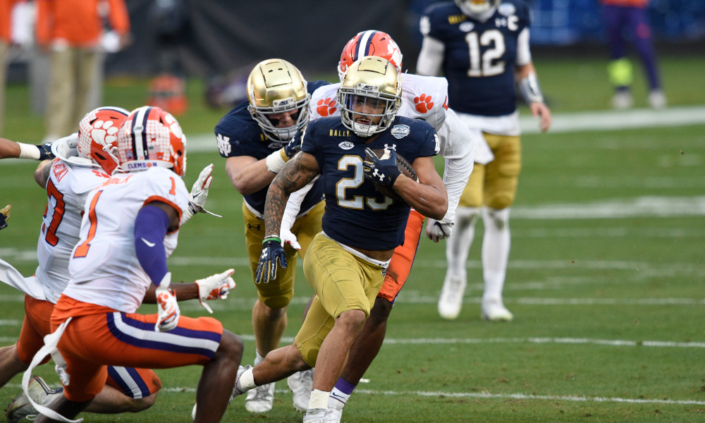 Kyren Williams of Notre Dame runs against Clemson's defense in ACC Championship