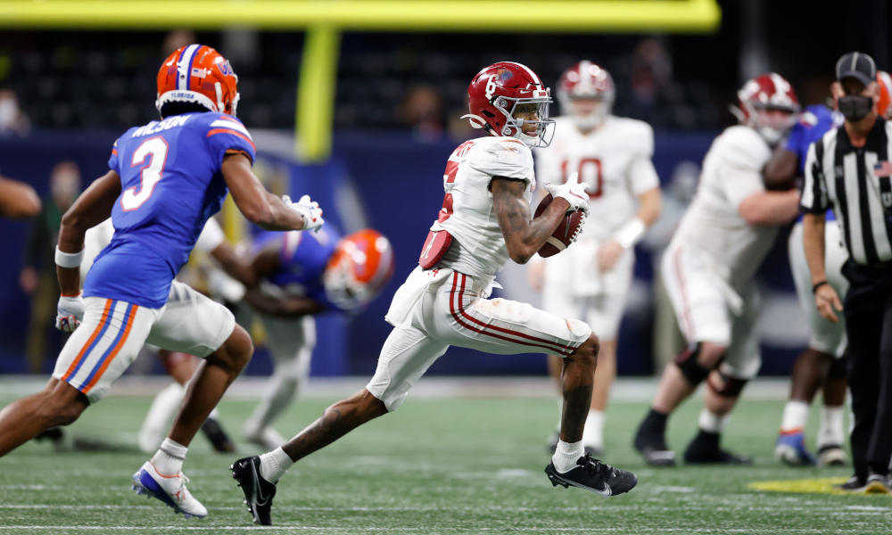 DeVonta Smith moving through Florida's defense with the ball in SEC Championship