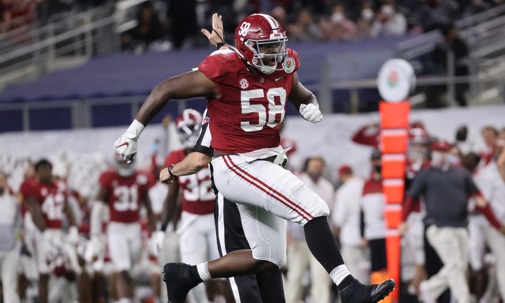 Christian Barmore of Alabama celebrates a sack against Ian Book of Notre Dame