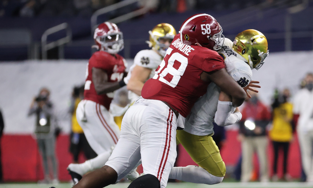 Christian Barmore (No. 58) of Alabama sacks Ian Book at Rose Bowl Game