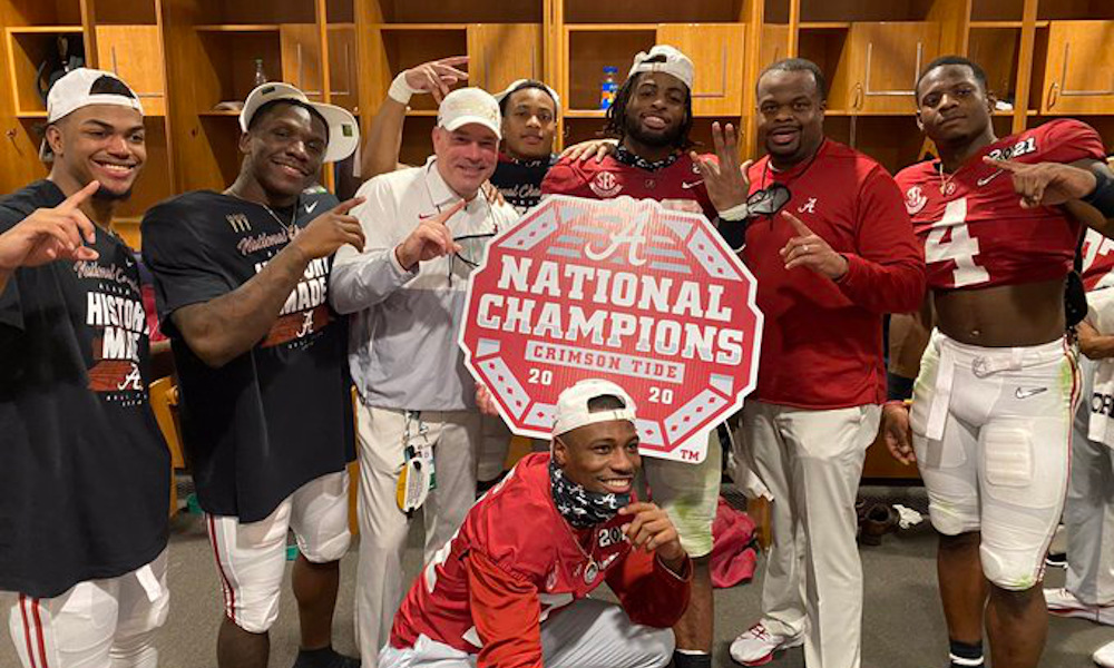 Charles Huff (in red shirt) celebrates CFP title with Alabama