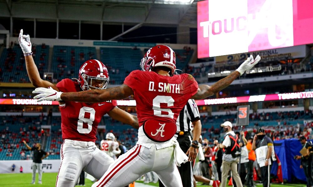 DeVonta Smith and John Metchie celebrate a touchdown