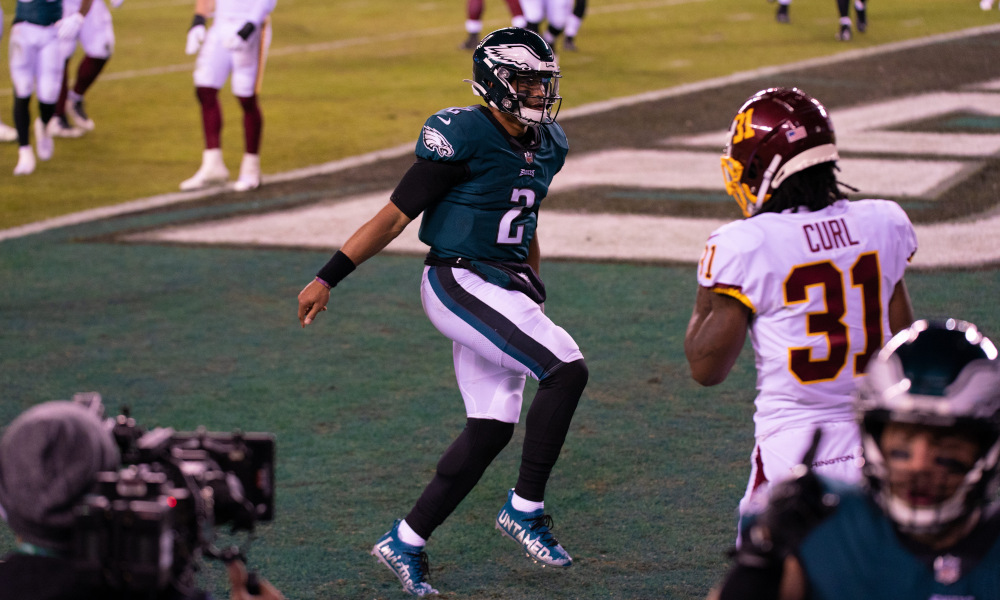Jalen Hurts celebrates a touchdown for Eagles versus Washington