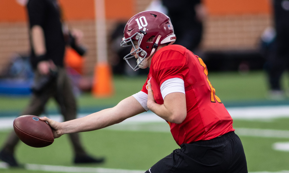 Mac Jones of Alabama executes handoff drills for American team at Senior Bowl