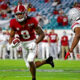 John Metchie runs with the ball against Shaun Wade of Ohio State in CFP title game