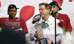 Nick Saban holds Rose Bowl trophy after Alabama defeated Notre Dame