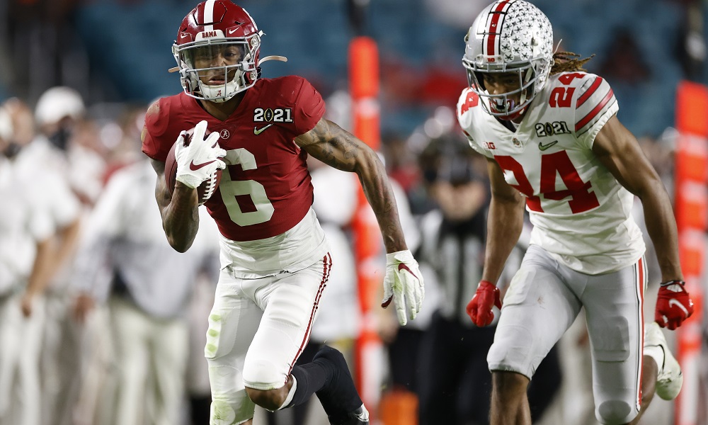 Alabama's DeVonta Smith runs by Shaun Wade of Ohio State for a touchdown in 2020 CFP title game