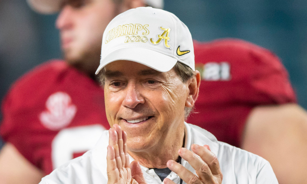 Nick Saban smiling and clapping after winning 2020 CFP title