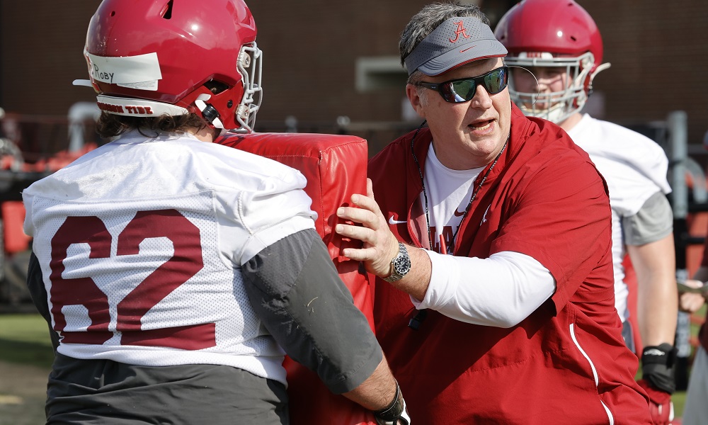 Doug Marrone working with Alabama's OL during spring practice