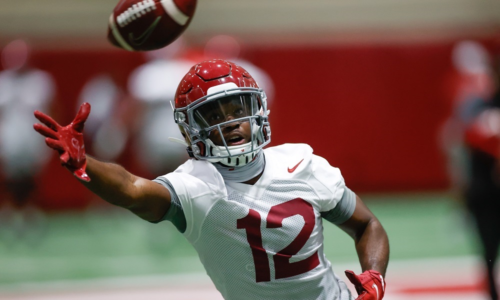 Christian Leary attempts to catch football at Alabama football Spring Prctice