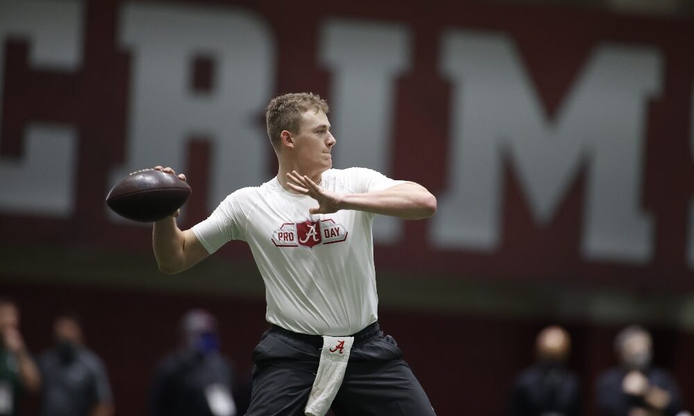 Mac Jones drops back to pass during his Pro Day