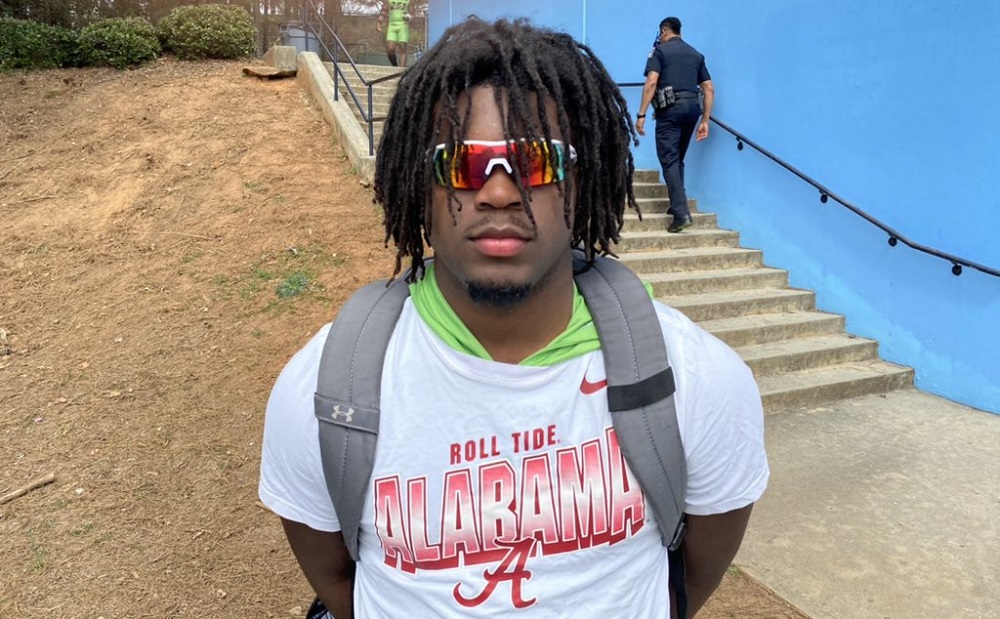 Alabama 2022 LB commit Robert Woodyad takes picture in Alabama shirt