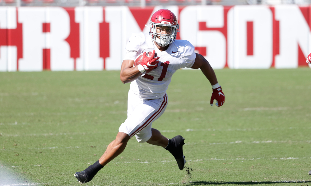 Jase McClellan (No. 21) runs with the ball in Alabama's spring scrimmage
