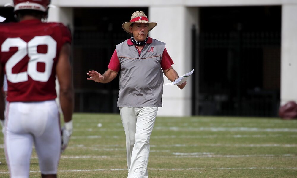 Nick Saban coaching players at Alabama's spring practice