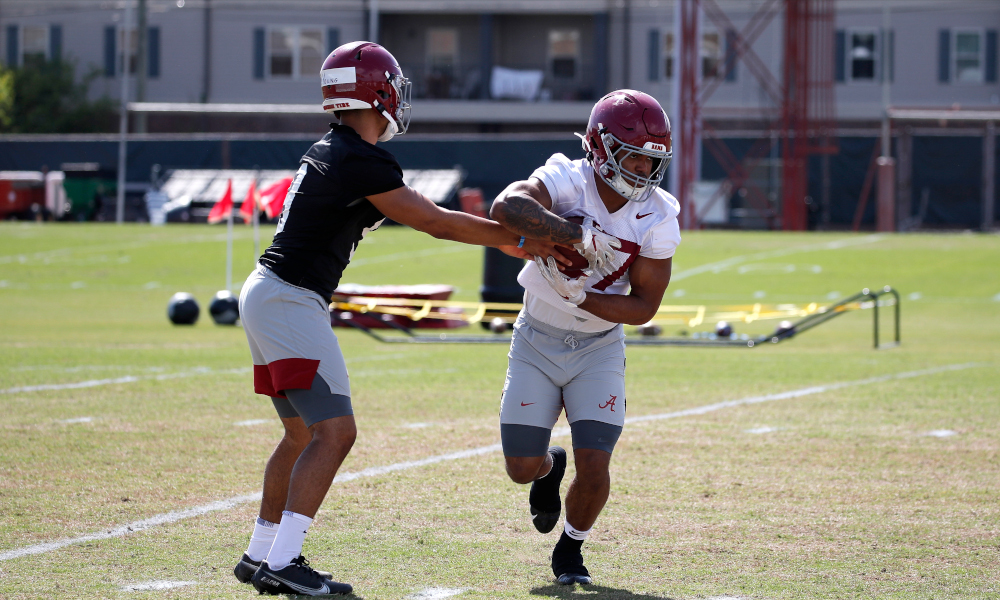 Bryce Young hands the ball to Kyle Edwards (No. 27) at Alabama spring practice