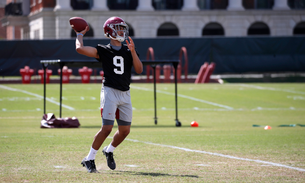 Bryce Young tossing a pass during Alabama spring practice