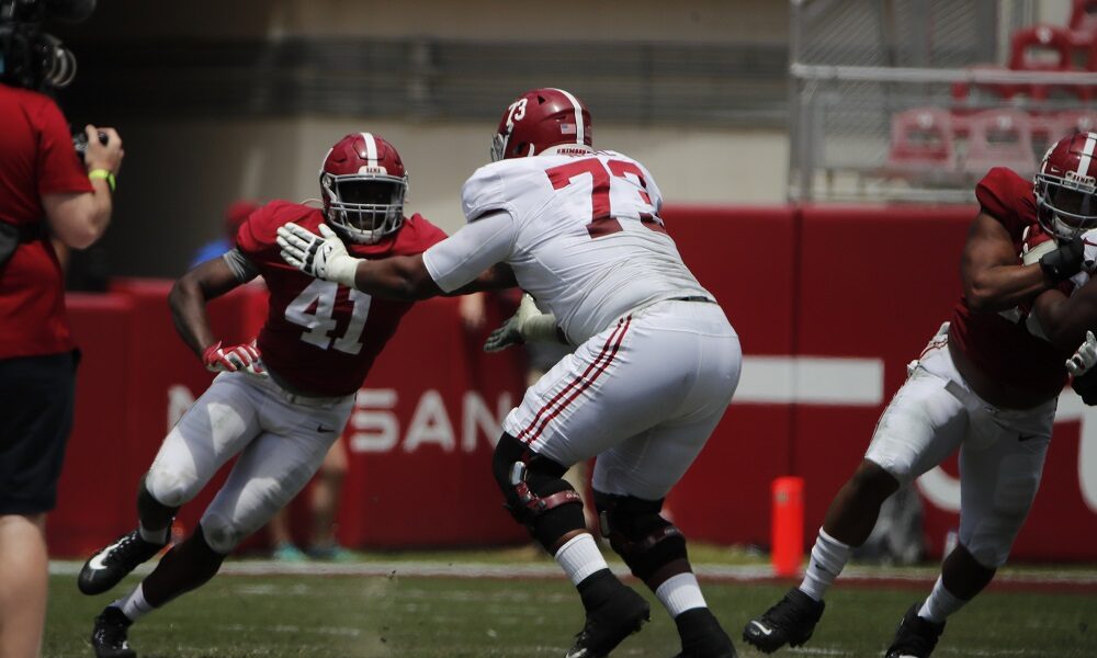 Chris Braswell (No. 41) trying to get around Evan Neal on A-Day