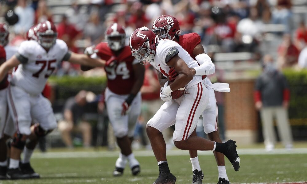 Traeshon Holden (No. 11) with a reception in Alabama's spring game