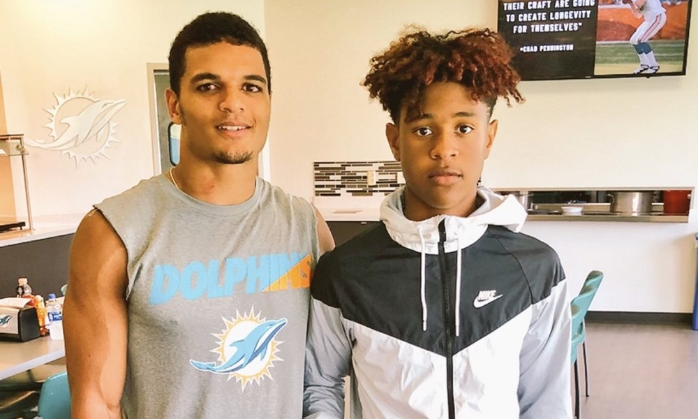 Earl Little Jr poses with Minkah Fitzpatrick