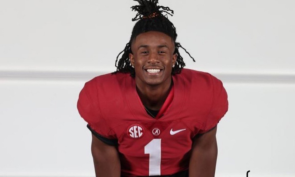Ga'Quincy McKinstry posing in his jersey during his visit to Alabama