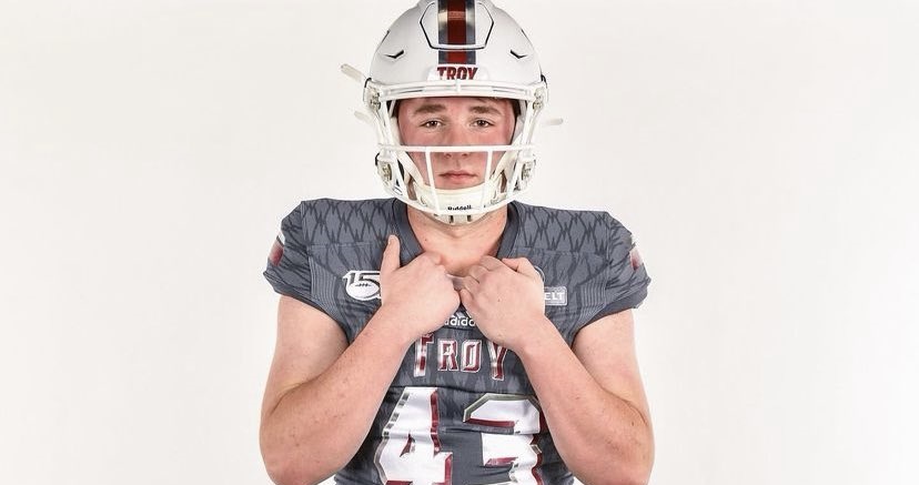 Jack Martin poses for picture in Troy uniform