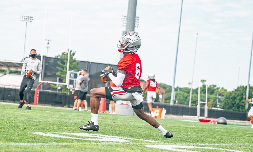 Jameson Williams catches a pass during Ohio State's practice