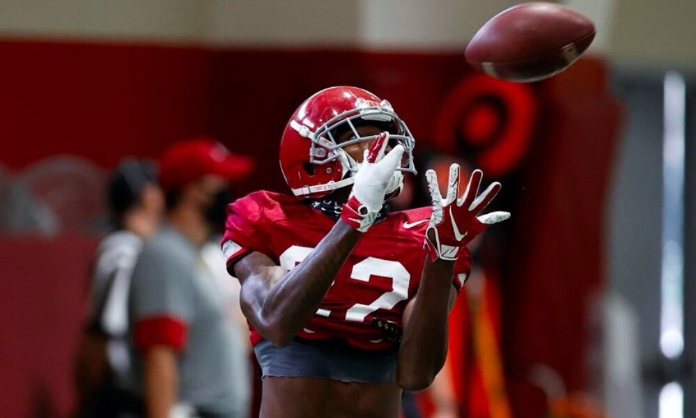 Ronald Williams catches an interception during practice
