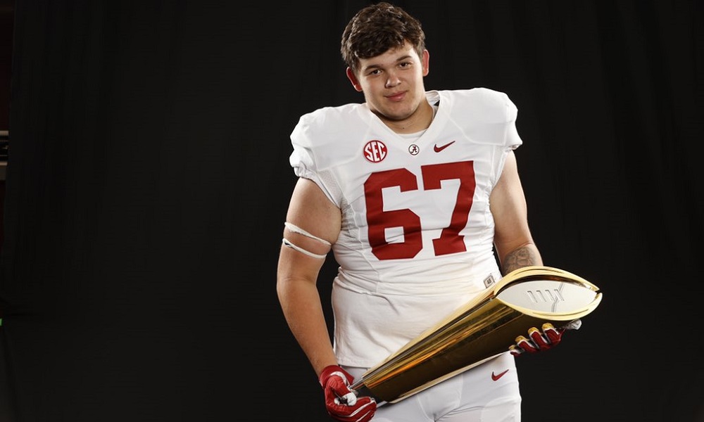 Dayne Shor holds CFP Champiosnhip trophy during Alabama official visit