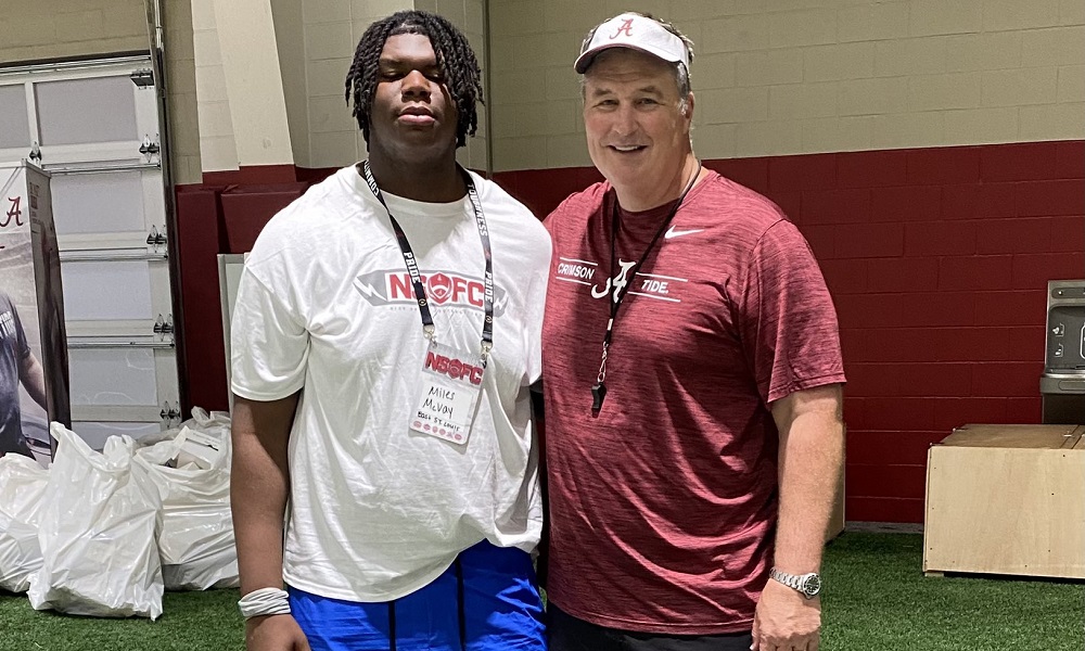 Miles McVay taks picture with Alabama offensive line coach Doug Marrone after camp