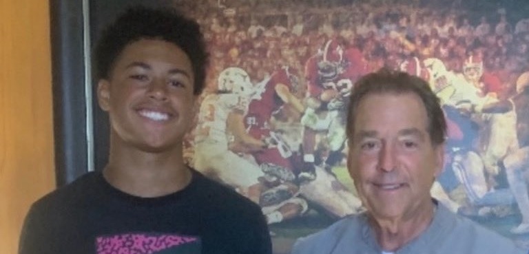 Nick Saban and Emmett Mosley pose for picture doing visit