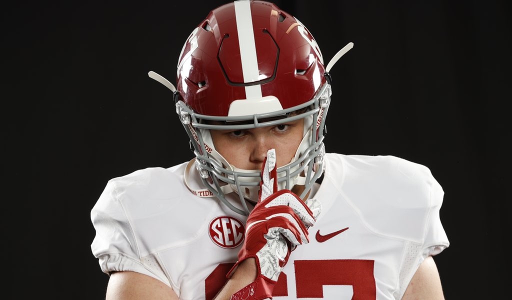Dayne Shor poses with finger to his mouth during Alabama visit
