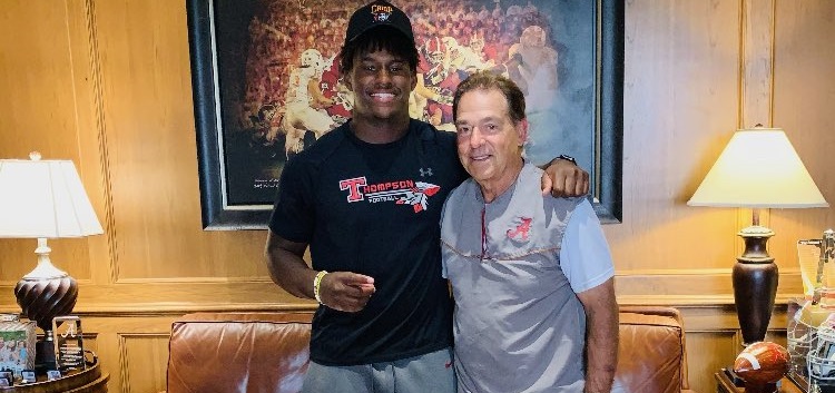 Jeremiah Alexander embraces Nick Saban during Alabama visit