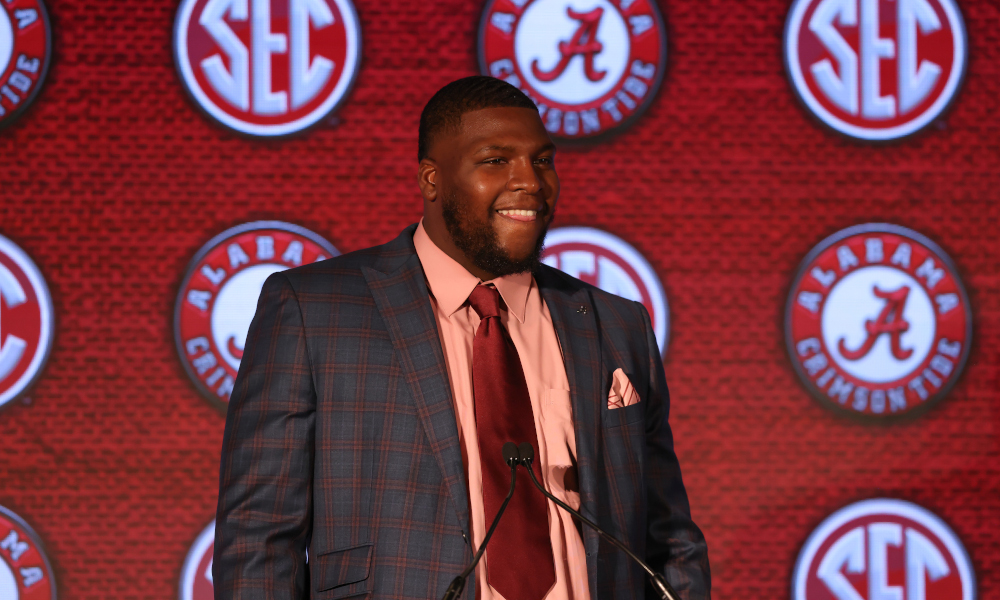 Alabama DL Phidarian Mathis smiling during an interview with reporters at SEC Media Days