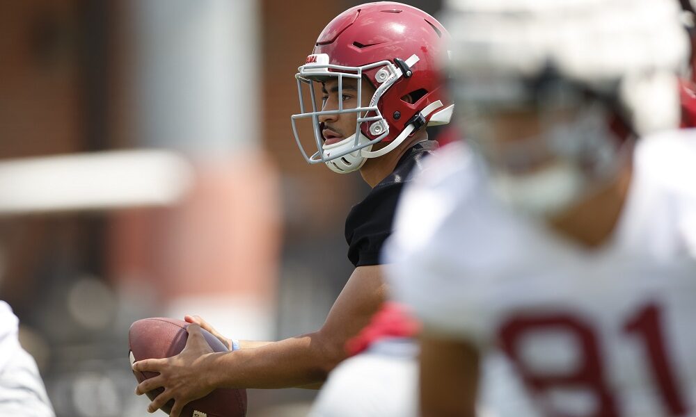 Bryce Young takes the snap at Alabama fall practice
