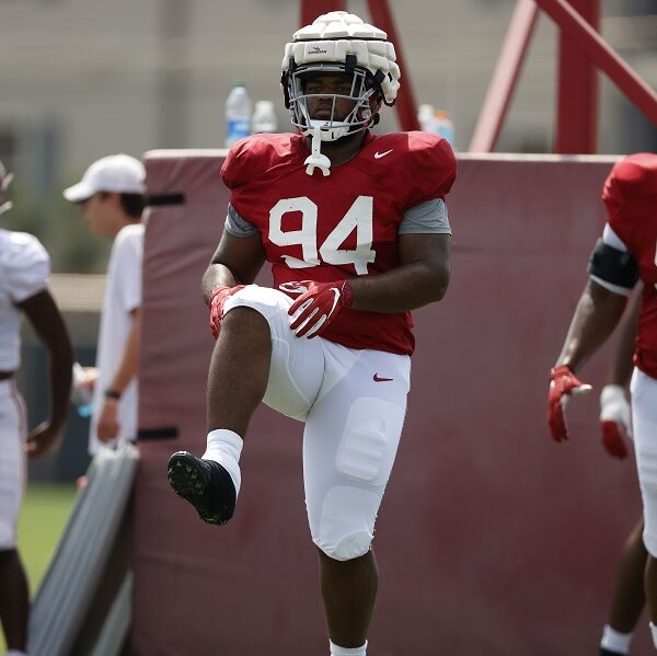 DJ Dale (No. 94) stretching before practice at Alabama